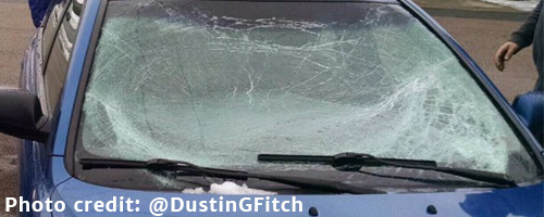 Snow flying off roof of car