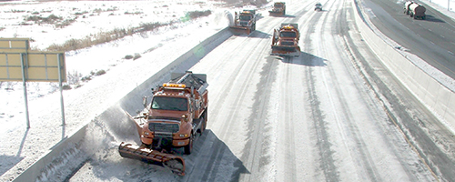 Snow plow crossing lanes